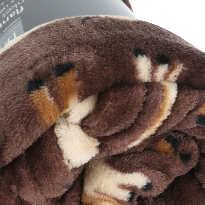 close up of soft cosy flannel material on highland cow blanket
