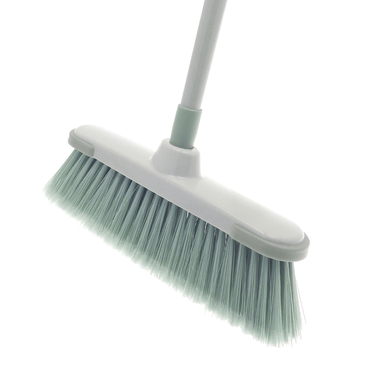 side view of broom featuring angled edge bristles in green colour