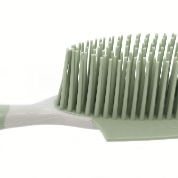 detail shot of rubber bristles in green colour on brush