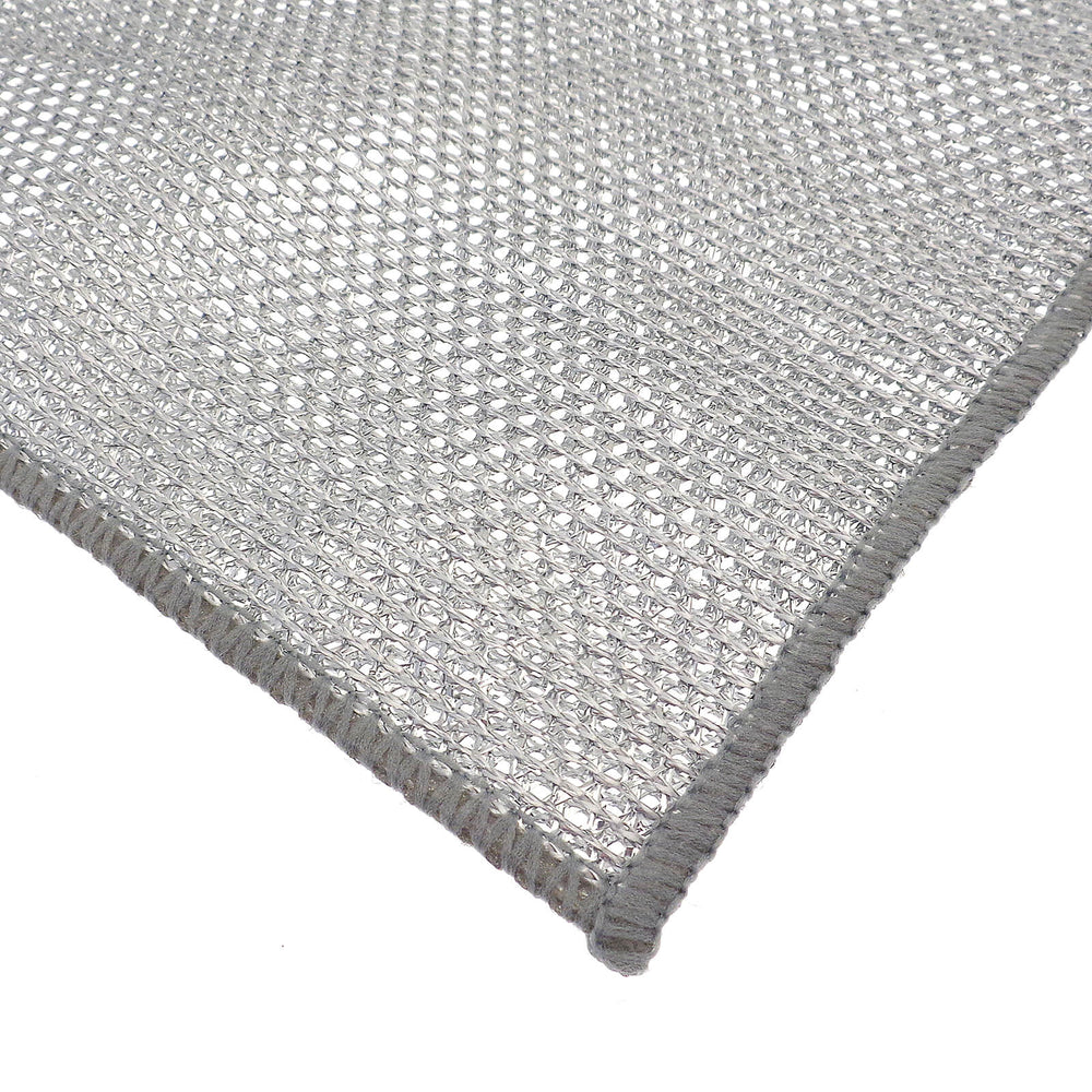 Close-up of a textured silver open weave cleaning cloth on a white background
