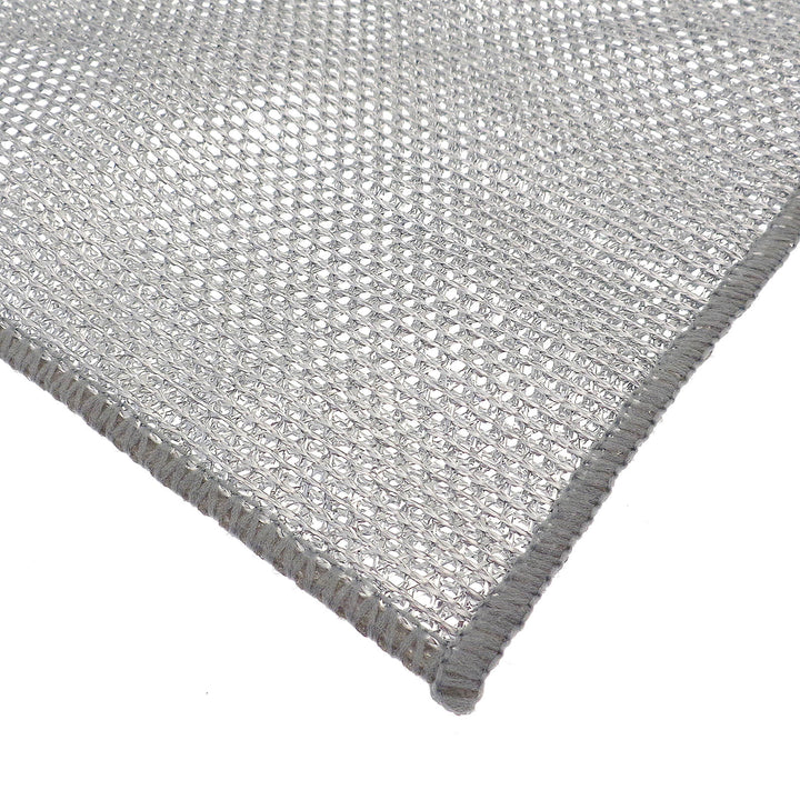 Close-up of a textured silver open weave cleaning cloth on a white background