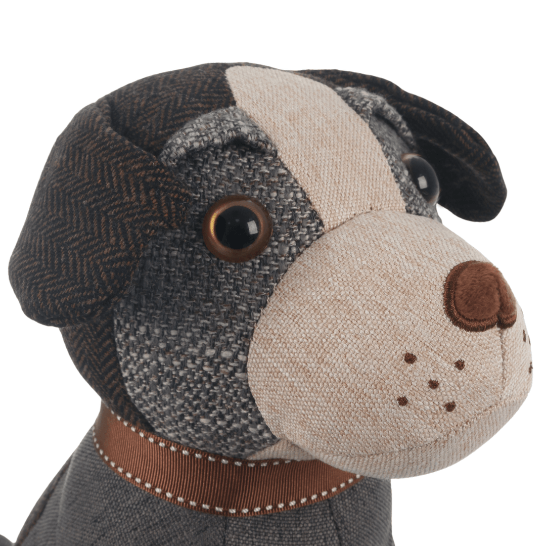 detail shot of jack russell dog door stop with beaded eyes and plush nose