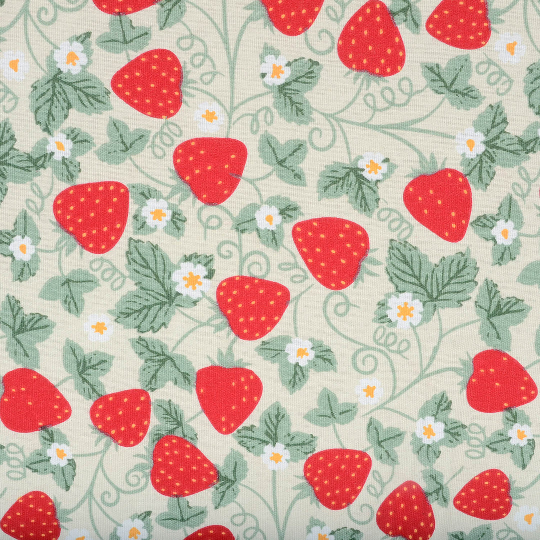 Pattern of red strawberries and green leaves on a beige background