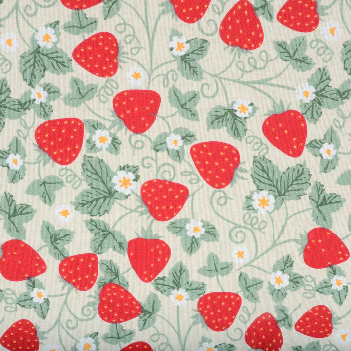 Pattern of red strawberries and green leaves on a beige background
