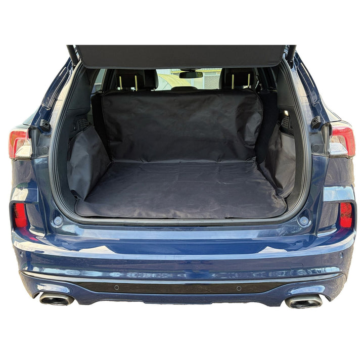 Blue car with open trunk showing a black pet liner inside
