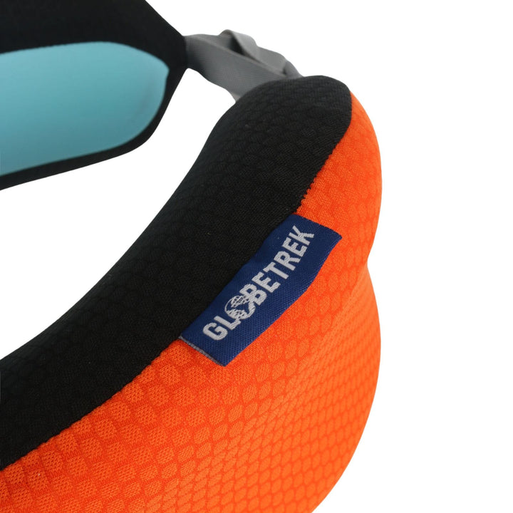 close up of blue coloured brand tab on orange neck pillow