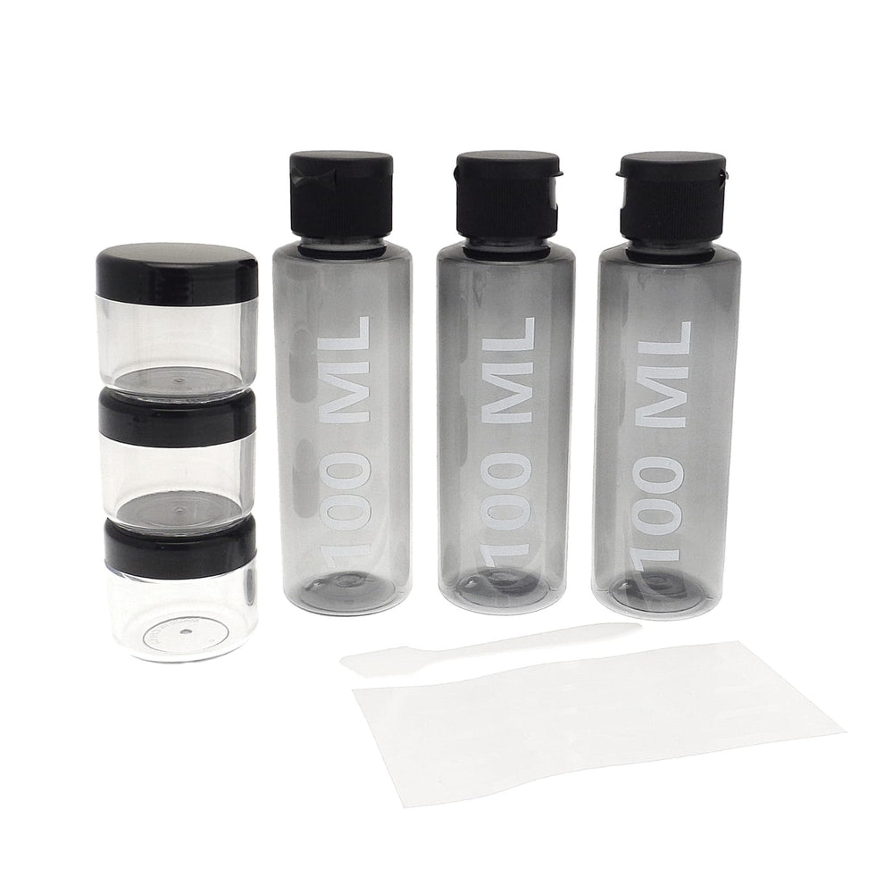3 100ml bottles beside 3 x 20g storage containers for creams with spatula, travel bottle set