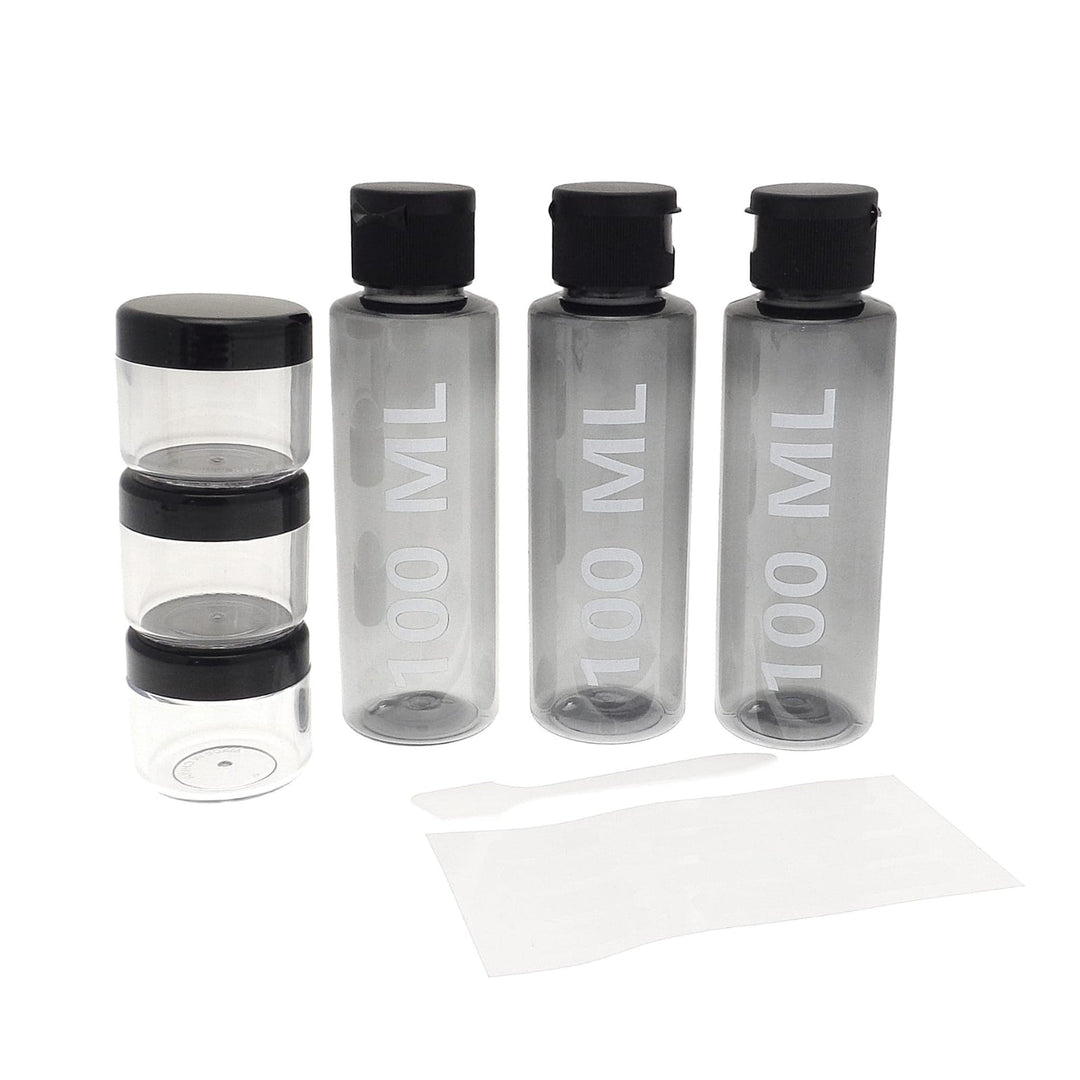 3 100ml bottles beside 3 x 20g storage containers for creams with spatula, travel bottle set