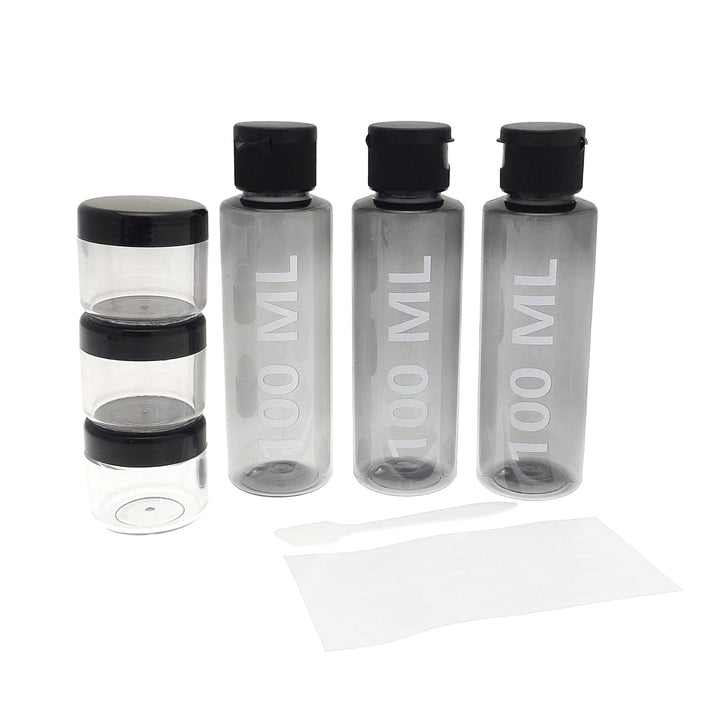 3 100ml bottles beside 3 x 20g storage containers for creams with spatula, travel bottle set
