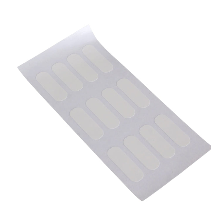 a sheet of 12 sticky tabs to personalise bottle contents on white background