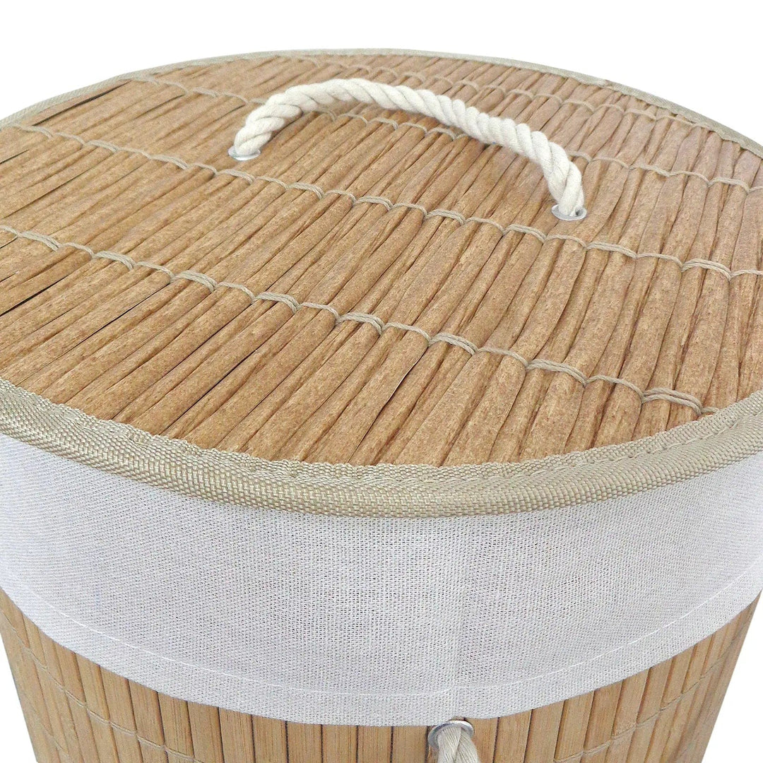 Details of rattan effect lid with white rope handle on a natural bamboo laundry basket on 