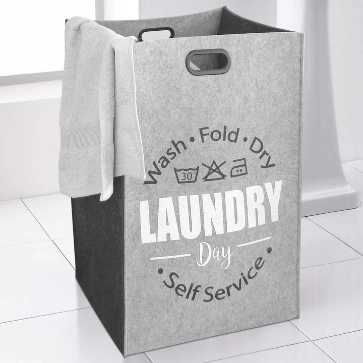 Light and dark grey felt laundry bag with Wash Fold Dry care instructions printed design