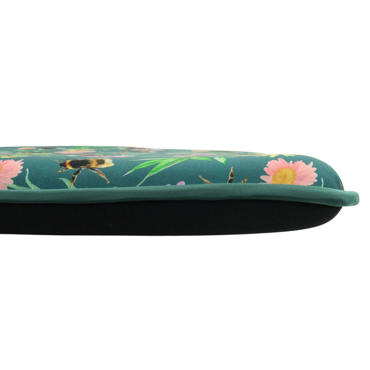 side view of kneeling mat with floral patterned top and all black, solid reverse