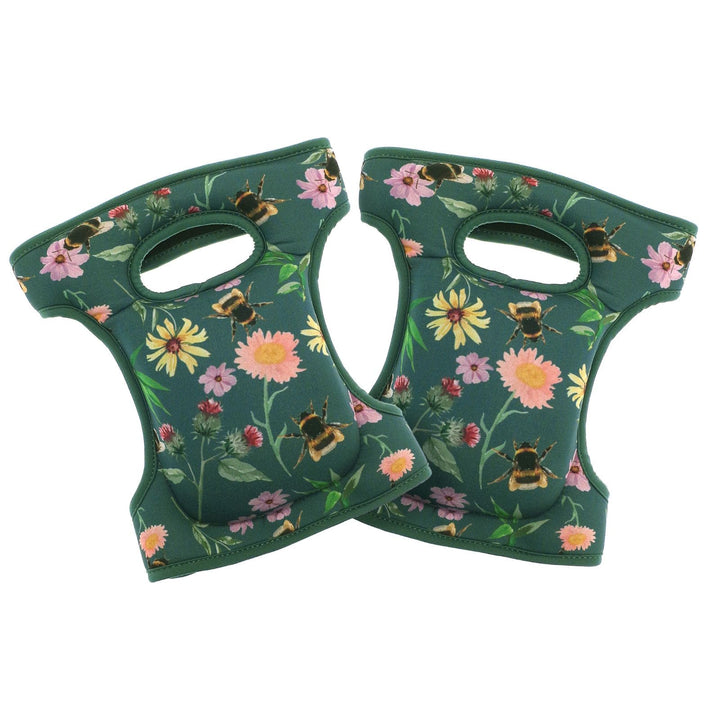two green fabric knee pads with cushioning and green floral &amp; bee pattern on white background