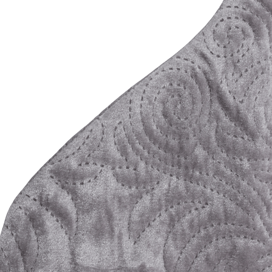 detail shot of embossed pattern on grey luxury stocking
