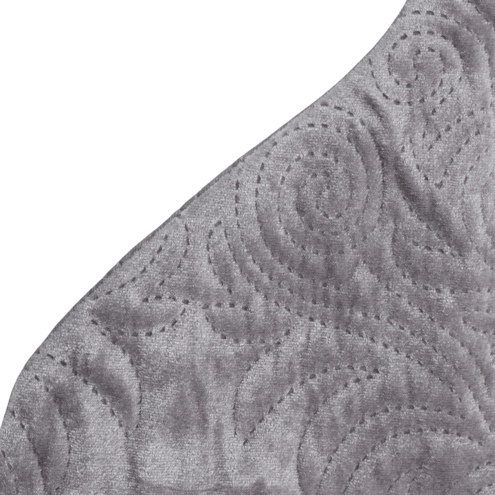 detail shot of embossed pattern on grey luxury stocking
