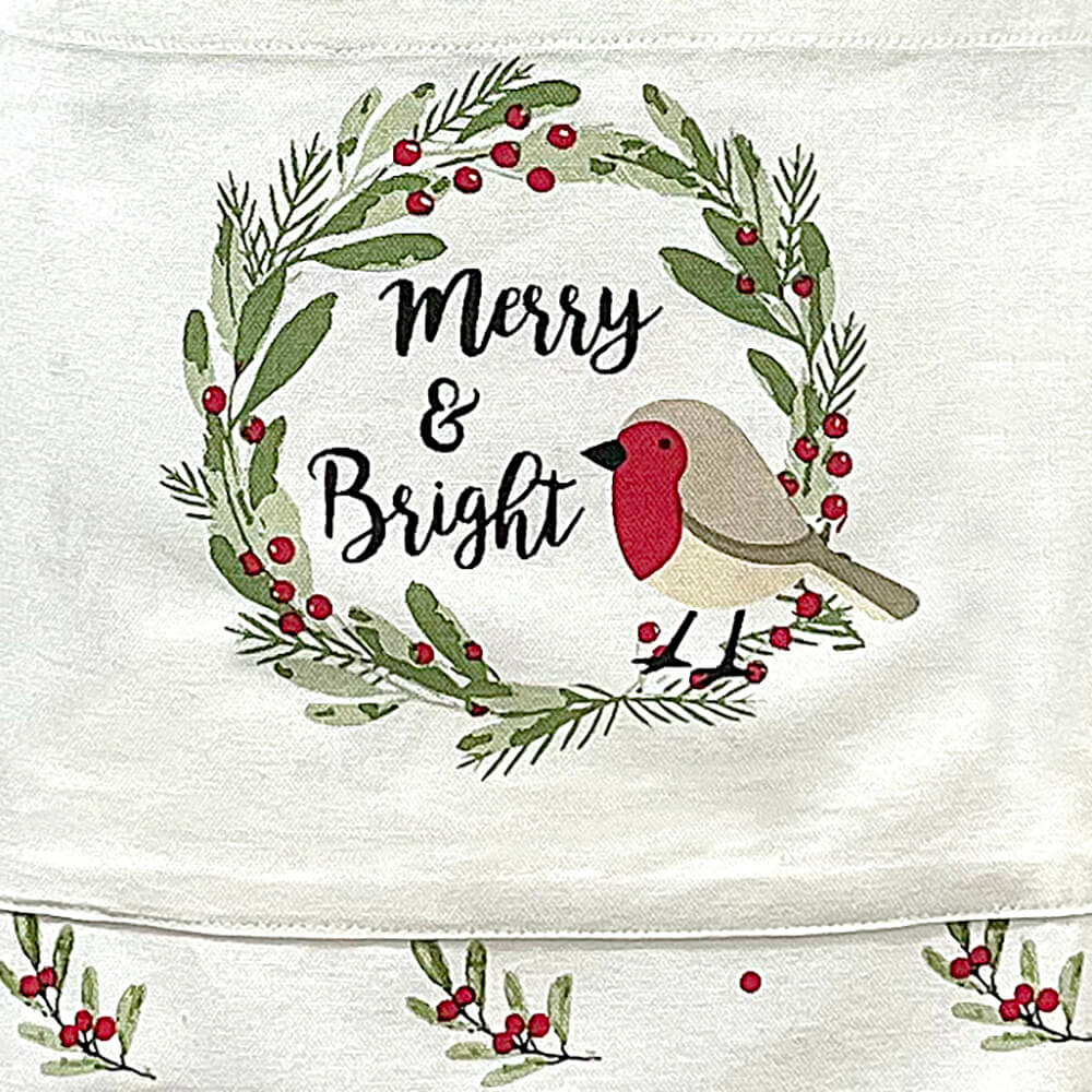 Close up of Christmas robin with Merry & Bright text on a festive apron pocket