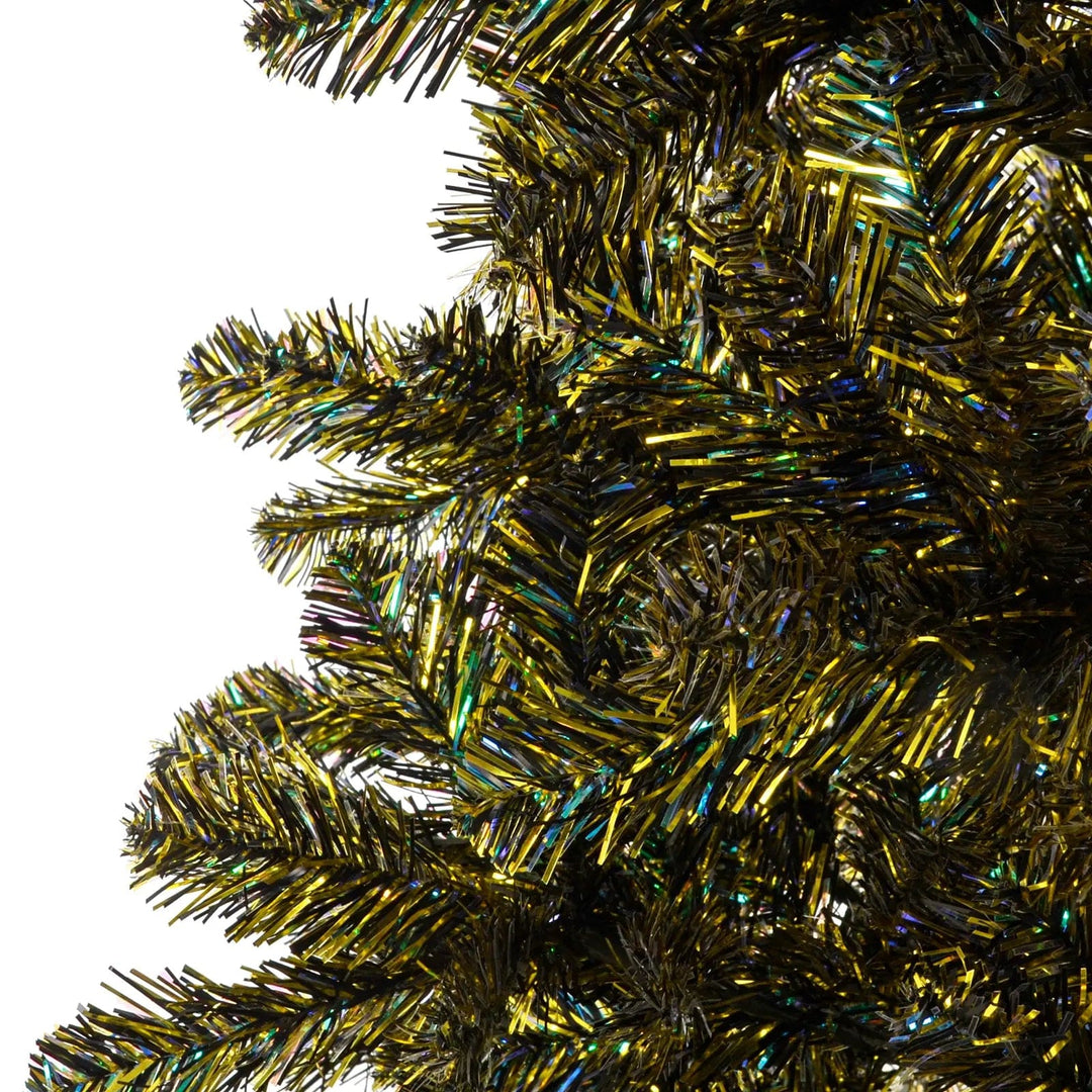 Close up of gold and iridescent green tinsel branches on a Christmas tree