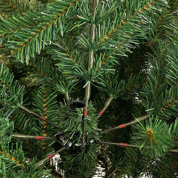 Detail of hinged green fir branches on a Christmas tree