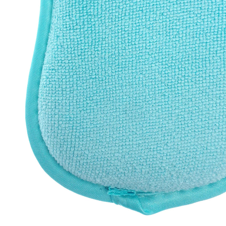 Close up of the soft polishing side of a blue microfibre padded scrubber