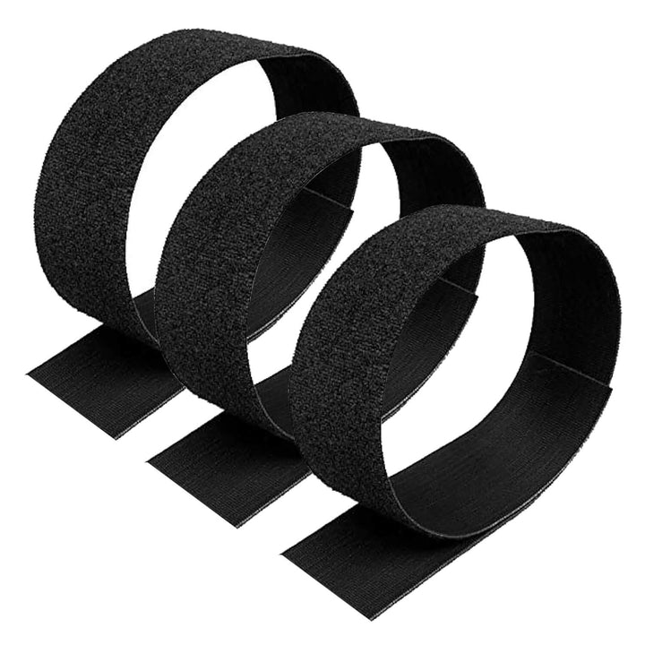 Three black velcro strips on a white background