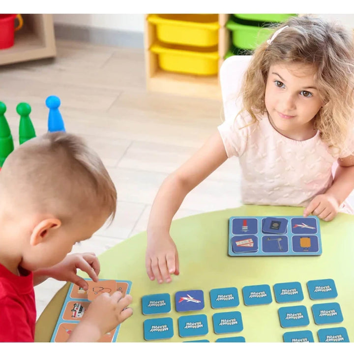 2 children playing a memory match game with tiles and boards