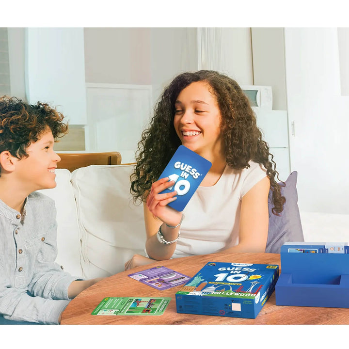 Girl and boy playing Guess in 10 American Cities card game