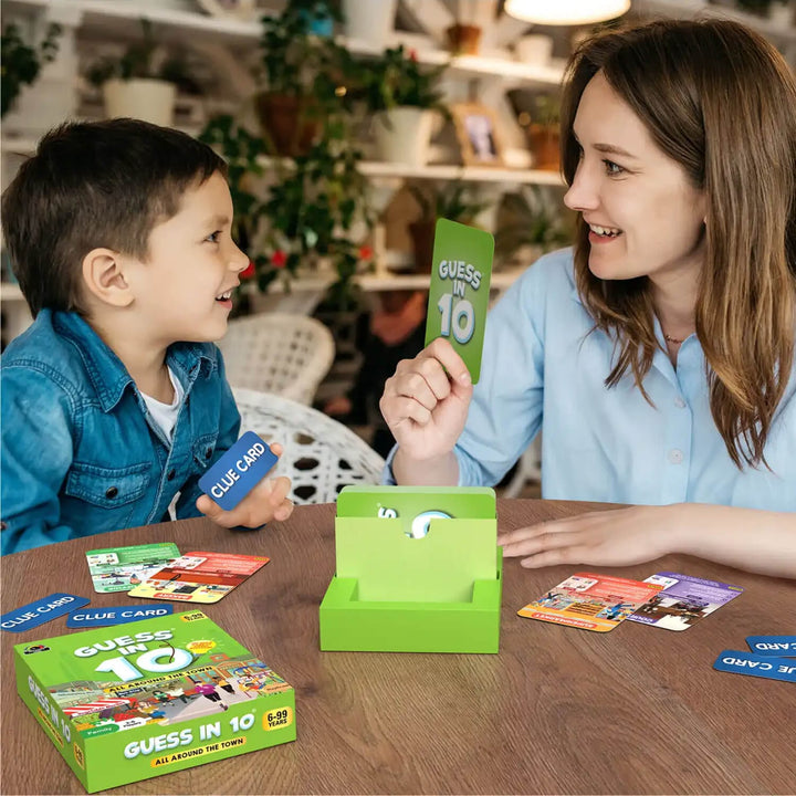 Woman and child playing Guess in 10 around the town themed card game