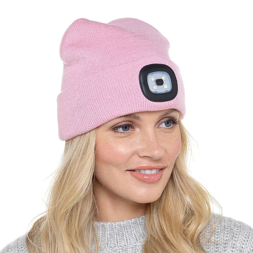 Lady wearing a pink beanie hat with LED light on the front