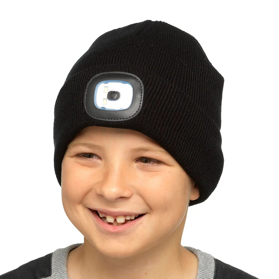 Boy wearing a black beanie hat with integral LED light on the front