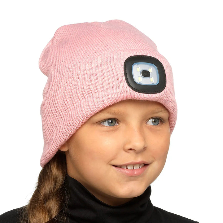 Girl wearing a pink beanie hat with LED light on the front