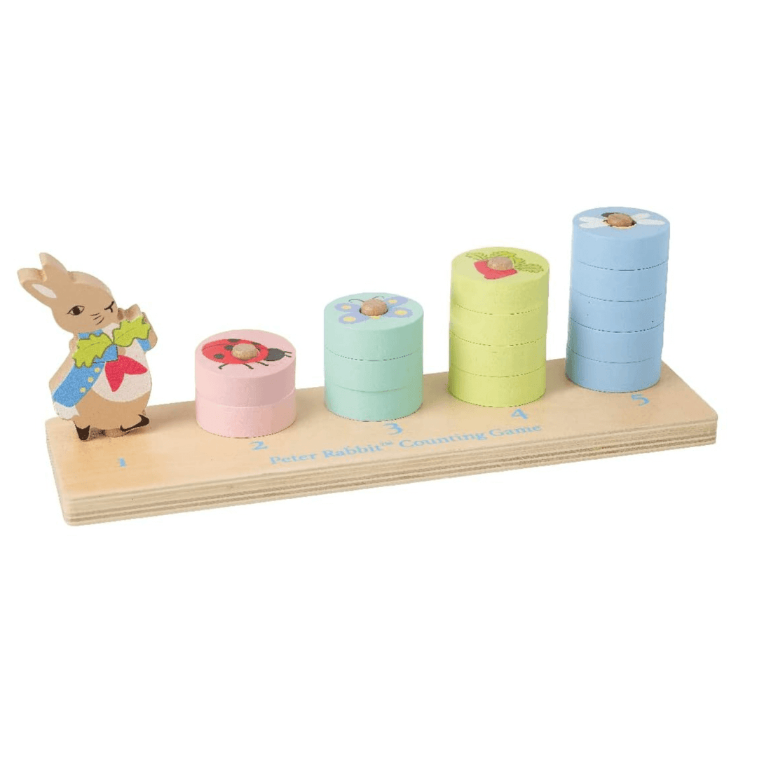 peter rabbit counting game with coloured discs stacked on holders - wooden board game