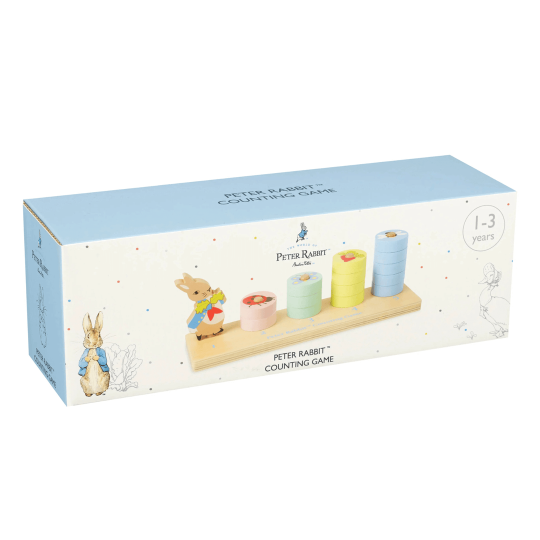 peter rabbit counting game packaging feature pastel colour polka dot print with image of product included inside the box and traditional beatrix potter drawings of peter rabbit
