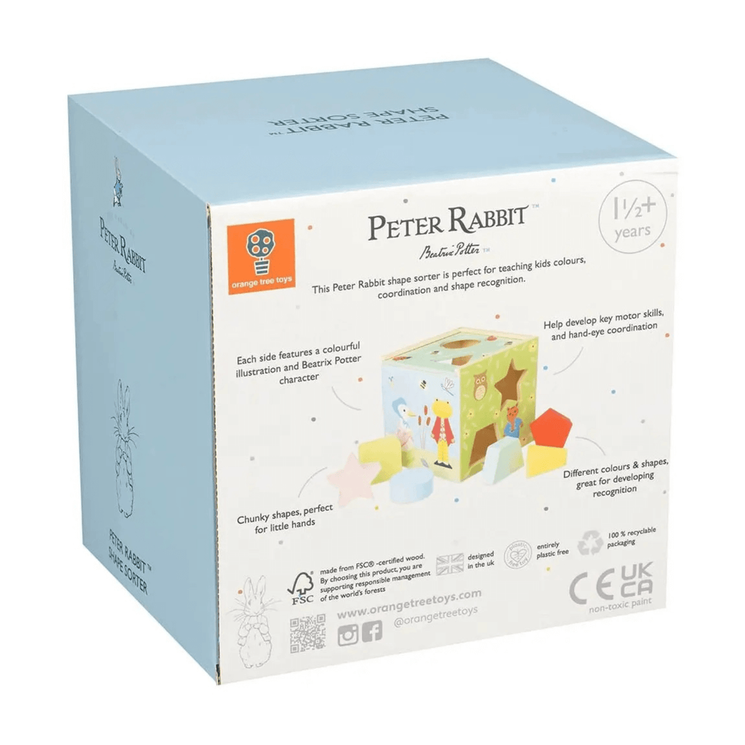 back view of peter rabbit cardboard packaging for shape sorter toy featuring details such as FSC certified wood, non toxic paint and designed in the UK