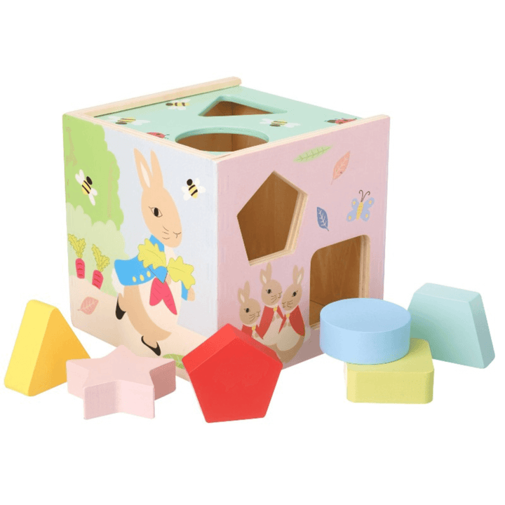 alternative side of wooden shape sorter toy featuring peter rabbit character illustration in pastel colours with pink star, yellow triangle shapes