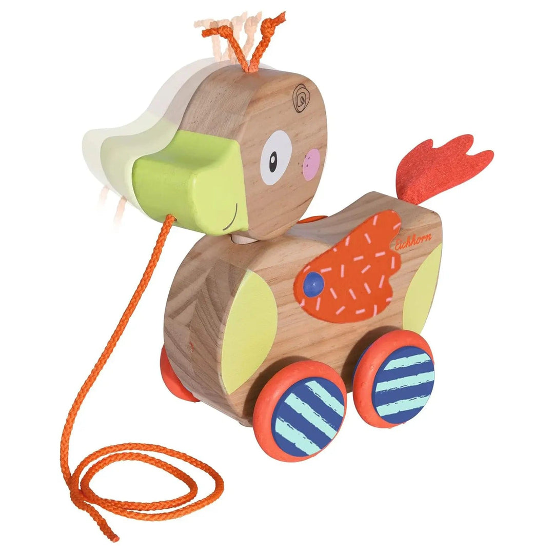 Wooden duck toy that moves its head and wings when it moves