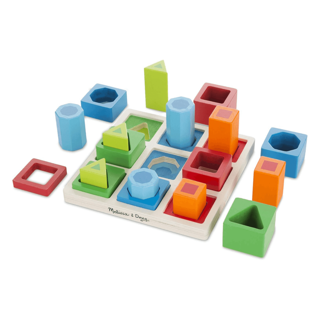 wooden shape sorted set with frame and blocks in various shapes, sizes and colours on white background