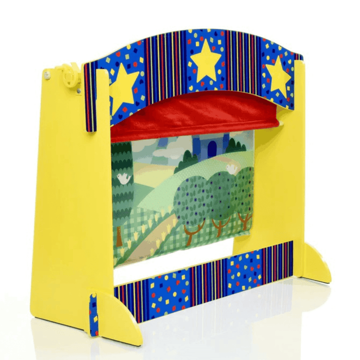 side view of puppet theatre with velvet curtain, kingdom backdrop with yellow and blue wooden structure