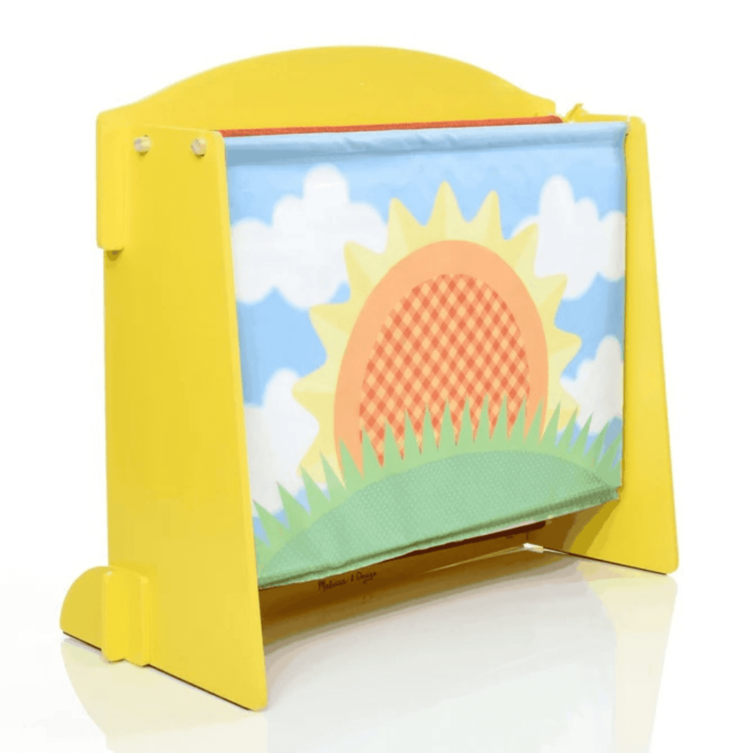 back view of puppet theatre with reversible backdrop showing sun and blue sky design