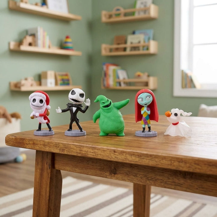 Five Disney The Nightmare Before Christmas character figurines arranged on a wooden table in a child&