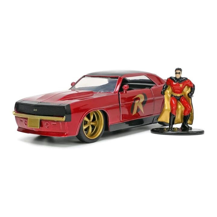 Die-cast Robin figure standing beside a red and gold chevy camaro for collectors