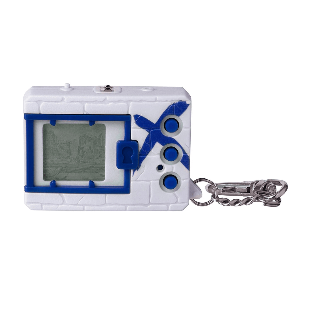 white digital monster game with blue x and silver keychain