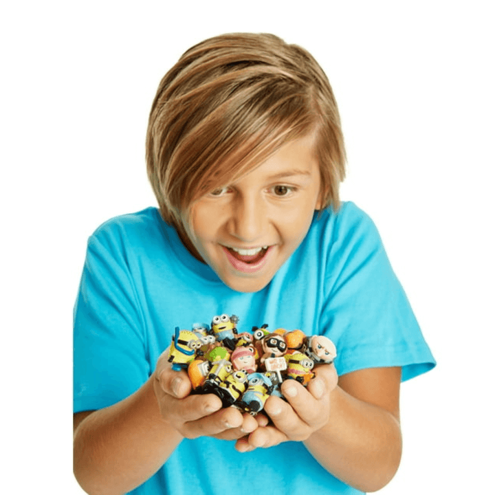 young boy holding various mineez in his hands