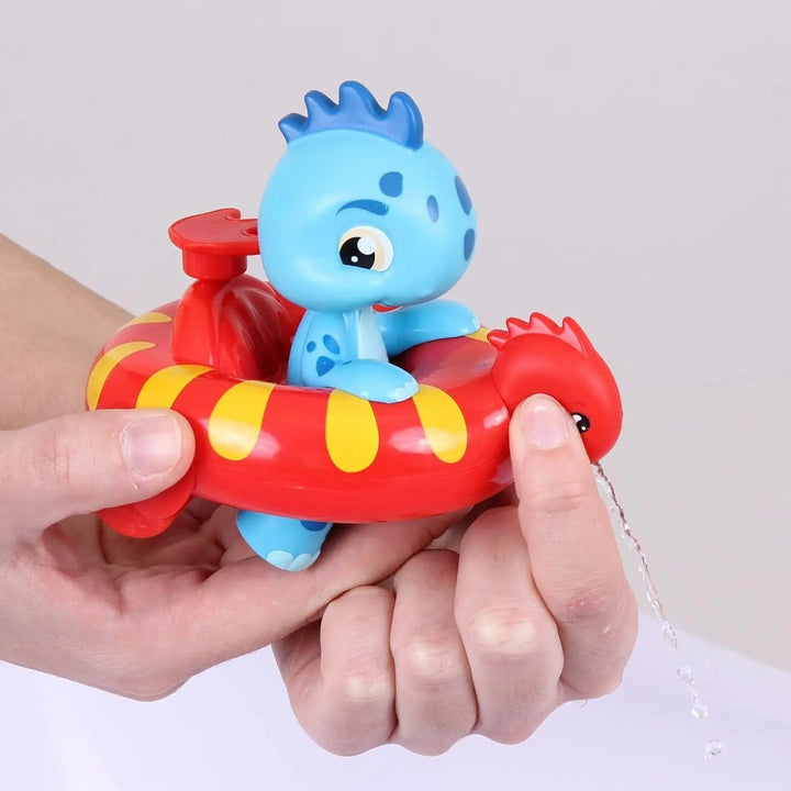 Hands holding a Bloopies FLoaties dinosaur bath toy that can squirt water