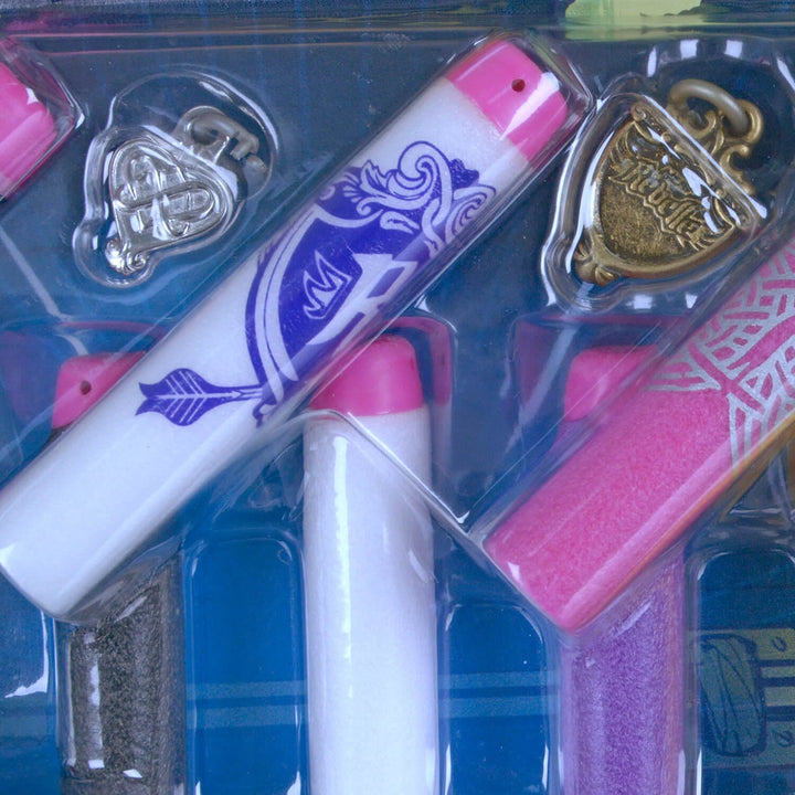 Close up of a Nerf Rebelle foam dart with a silver and gold charm