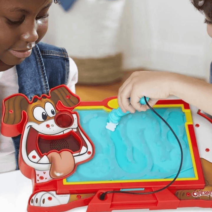 kids play operation pet scan by moving a teddy bear along the pets tummy