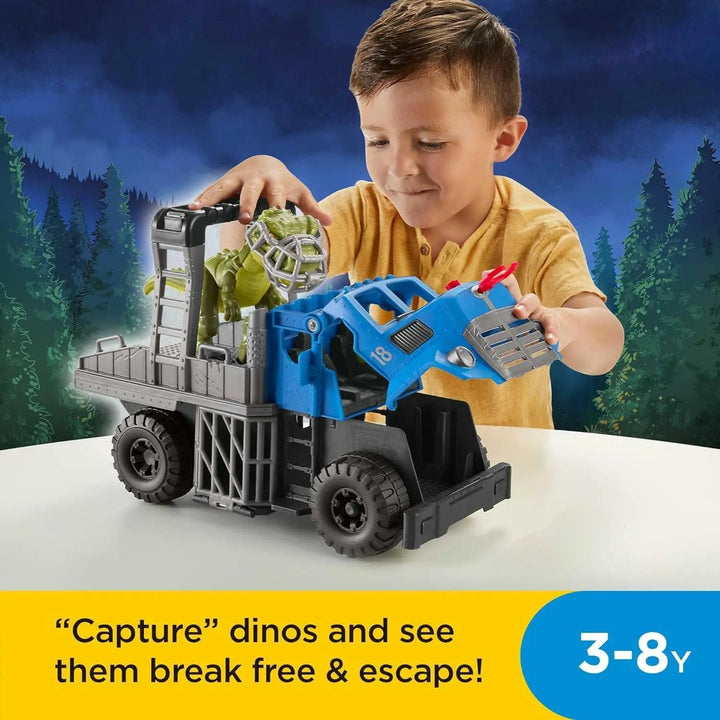 Child playing with a dinosaur hauler truck