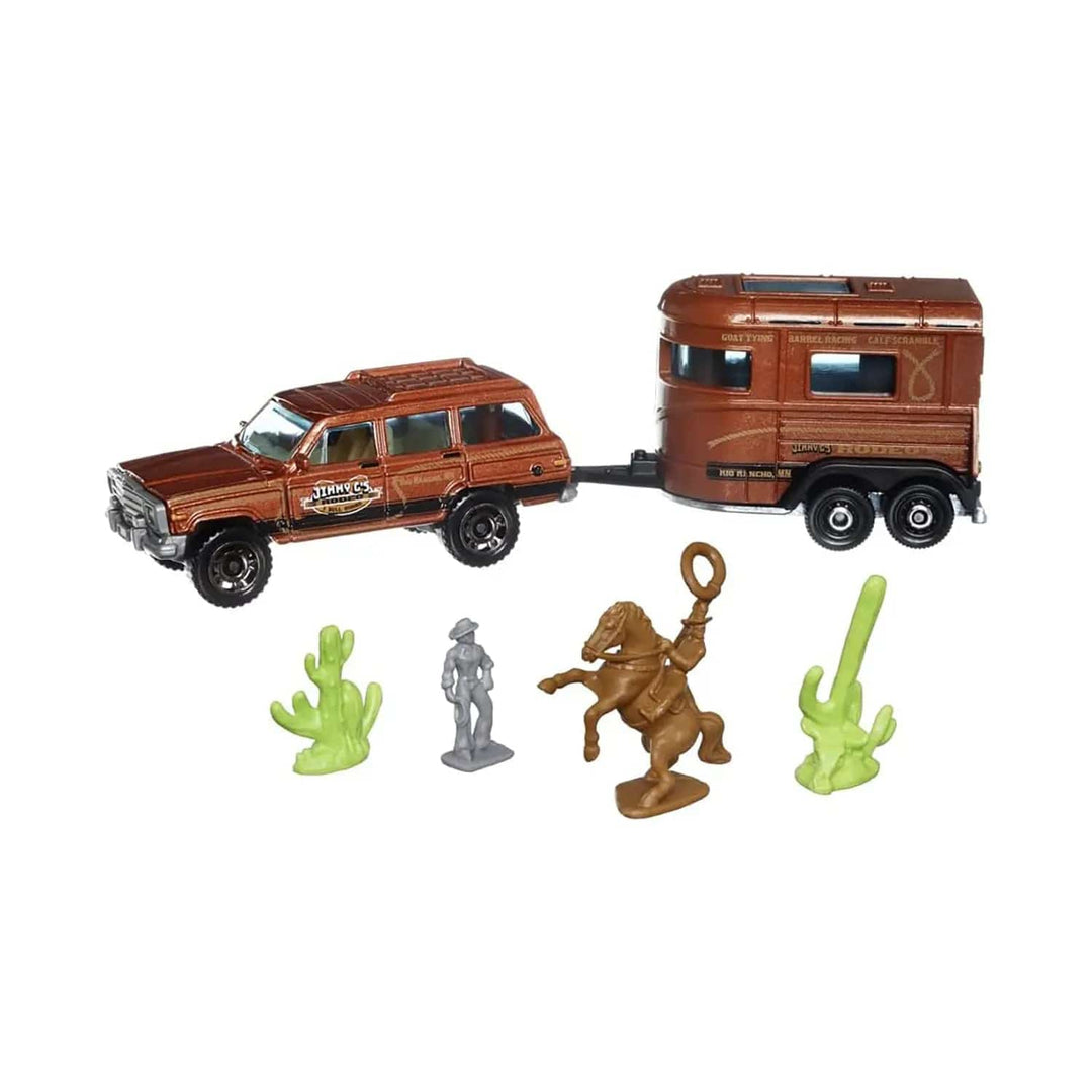 jeep towing a horse box with desert cactus, figure and rodeo rider