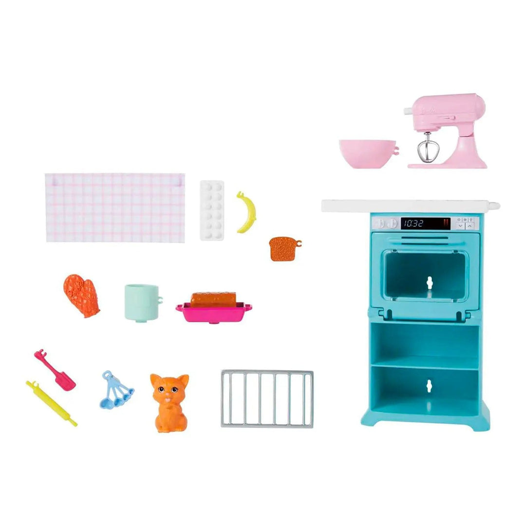 Barbie baking playset accessories laid out on white background