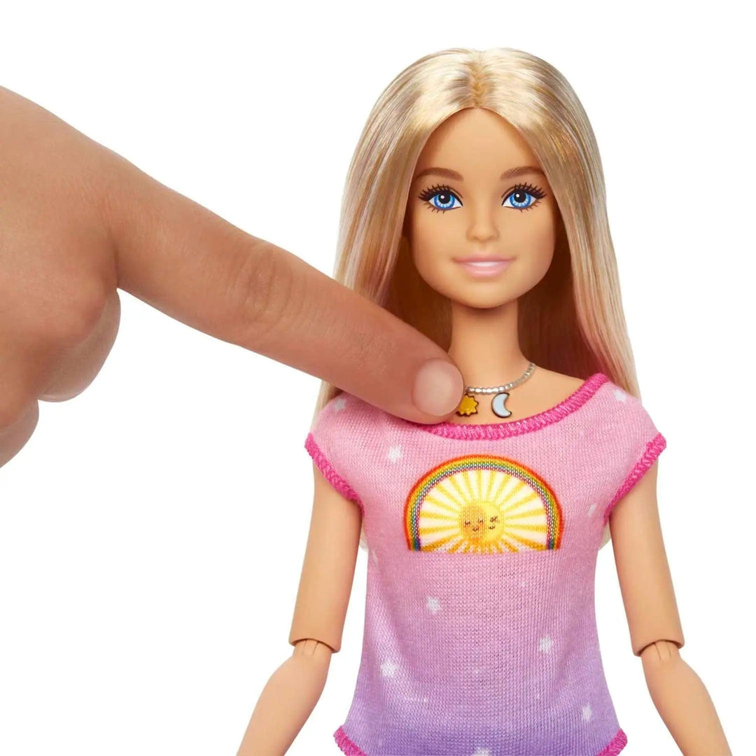 Press the sun charm on Barbie's necklace to activate day mode